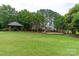 Community playground featuring a covered picnic area, swing set, slide, and climbing apparatus at 5656 Cambridge Bay Dr, Charlotte, NC 28269