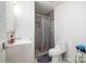 Tiled shower and modern sink in bathroom at 5772 Gettysburg Nw Dr, Concord, NC 28027