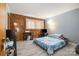 Bedroom with wood wall, gray accent wall, and laminate flooring at 5772 Gettysburg Nw Dr, Concord, NC 28027