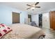 Bedroom featuring a ceiling fan, closet and modern accents at 5772 Gettysburg Nw Dr, Concord, NC 28027