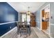 Cozy dining room showcasing stylish table and chairs, complemented by a vintage china cabinet and hardwood floors at 5772 Gettysburg Nw Dr, Concord, NC 28027
