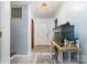 Entry hallway featuring tiled floors, a fish tank, wood accents and white walls at 5772 Gettysburg Nw Dr, Concord, NC 28027