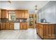 Sunny kitchen features light wood cabinetry, a tile backsplash, and sliding door access to the backyard at 5772 Gettysburg Nw Dr, Concord, NC 28027