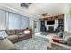 Spacious living room with blue accents, comfortable seating, and fireplace at 5772 Gettysburg Nw Dr, Concord, NC 28027