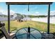 A spacious backyard includes a manicured lawn, privacy fence, fire pit with Adirondack chairs, and a glass-topped table at 5812 Camp Sw Ct, Concord, NC 28025