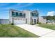 Beautiful two-story home with a spacious driveway and well-maintained front yard landscaping at 5812 Camp Sw Ct, Concord, NC 28025