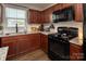 Updated kitchen boasting granite countertops and black appliances at 5812 Camp Sw Ct, Concord, NC 28025