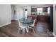Open kitchen and dining area with hardwood floors and view of outdoor space at 5812 Camp Sw Ct, Concord, NC 28025