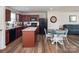 Updated kitchen with stainless steel appliances, granite counters, and an open layout to the living room at 5812 Camp Sw Ct, Concord, NC 28025