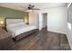 Spacious main bedroom with wood-look floors, neutral walls, and a ceiling fan at 5812 Camp Sw Ct, Concord, NC 28025