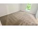 Comfortable bedroom with neutral carpet and natural light at 6041 Misty Way Ln, Charlotte, NC 28212