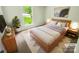 Cozy staged bedroom featuring a stylish bed, matching nightstands, and a bright window at 6041 Misty Way Ln, Charlotte, NC 28212