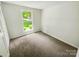 Cozy bedroom with large window providing natural light at 6041 Misty Way Ln, Charlotte, NC 28212