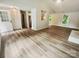 Open-concept living room with new floors and natural light at 6041 Misty Way Ln, Charlotte, NC 28212