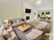 Bright, staged living room features modern furniture, fireplace, and ample natural light at 6041 Misty Way Ln, Charlotte, NC 28212
