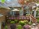 Spacious deck with outdoor seating and grill surrounded by lush landscaping at 617 Peace Haven Rd, Kannapolis, NC 28083