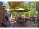 Outdoor seating on wooden deck with view of manicured backyard and shed at 617 Peace Haven Rd, Kannapolis, NC 28083