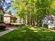 Spacious backyard with patio area, shed, and surrounded by trees at 617 Peace Haven Rd, Kannapolis, NC 28083