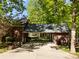 Brick-covered driveway leading to a lush backyard surrounded by trees at 617 Peace Haven Rd, Kannapolis, NC 28083