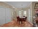 Cozy dining area featuring tiled floors, a round table, and natural light from the windows at 617 Peace Haven Rd, Kannapolis, NC 28083