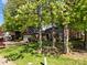 Charming brick home with mature trees, a well-manicured lawn, and attached garage at 617 Peace Haven Rd, Kannapolis, NC 28083