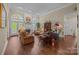 Inviting living room featuring a cozy fireplace, hardwood floors, and plenty of seating at 617 Peace Haven Rd, Kannapolis, NC 28083