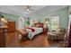 A main bedroom has hardwood floors, an accent wall, and a tray ceiling with recessed lighting at 617 Peace Haven Rd, Kannapolis, NC 28083
