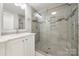 Modern bathroom with glass shower, tiled walls, and a vanity with great lighting at 64 Timberidge Dr, Lake Wylie, SC 29710