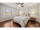 Cozy bedroom with hardwood floors, natural lighting, and a ceiling fan at 64 Timberidge Dr, Lake Wylie, SC 29710