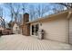 Expansive deck with grill, perfect for outdoor entertaining with access to the home's interior via sliding glass doors at 64 Timberidge Dr, Lake Wylie, SC 29710