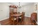 Elegant dining room featuring hardwood floors, a classic china cabinet, and a formal dining table perfect for entertaining at 64 Timberidge Dr, Lake Wylie, SC 29710