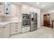 Well-appointed kitchen with stainless steel appliances, white cabinetry, and sleek countertops, offering a modern and functional space at 64 Timberidge Dr, Lake Wylie, SC 29710