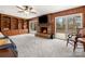 Large living room with fireplace, built-in shelving, and sliding glass doors to deck with wood paneling at 64 Timberidge Dr, Lake Wylie, SC 29710