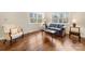 Comfortable living room features hardwood floors and natural light from two windows at 64 Timberidge Dr, Lake Wylie, SC 29710