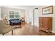 Cozy living room featuring hardwood floors and lots of natural light from a large window at 64 Timberidge Dr, Lake Wylie, SC 29710
