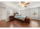 Main bedroom with hardwood floors, ceiling fan, and sunny windows for natural light at 64 Timberidge Dr, Lake Wylie, SC 29710