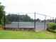 Outdoor tennis court with a black chain-link fence at 64 Timberidge Dr, Lake Wylie, SC 29710
