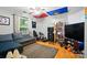 A bedroom featuring hardwood floors, natural light, and ample space for relaxation at 6717 Bickham Ln, Charlotte, NC 28269