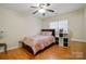 Cozy bedroom with a ceiling fan and great natural light from the window at 6717 Bickham Ln, Charlotte, NC 28269