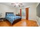 Relaxing bedroom featuring hardwood floors, natural light, and an inviting bed at 6717 Bickham Ln, Charlotte, NC 28269