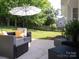 Enjoy the outdoors on this back patio with outdoor seating and umbrella at 7122 Marlin St, Gastonia, NC 28056