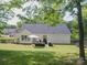 This backyard boasts a patio area for outdoor relaxation and entertaining guests at 7122 Marlin St, Gastonia, NC 28056