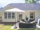 A backyard patio offers a comfortable seating area, ideal for relaxation and social gatherings at 7122 Marlin St, Gastonia, NC 28056