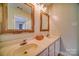 Bathroom featuring a double vanity, decorative mirrors, and modern fixtures, providing a functional and stylish space at 7122 Marlin St, Gastonia, NC 28056