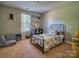 bedroom features a black metal bed frame and playful decor at 7122 Marlin St, Gastonia, NC 28056