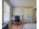 The bedroom features a functional desk and a cozy atmosphere with ample natural light at 7122 Marlin St, Gastonia, NC 28056