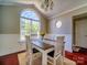 Elegant dining room with large window and decorative chandelier for delightful dining experiences at 7122 Marlin St, Gastonia, NC 28056
