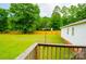 View from the deck highlighting the spacious, fenced backyard, with mature trees adding privacy at 745 Rock Castle Dr, York, SC 29745