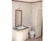Bathroom featuring a vanity with sink, toilet, and a floral wallpaper design at 745 Rock Castle Dr, York, SC 29745