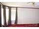 A light-filled bedroom with ceiling fan, carpeted floor, and window coverings for privacy at 745 Rock Castle Dr, York, SC 29745